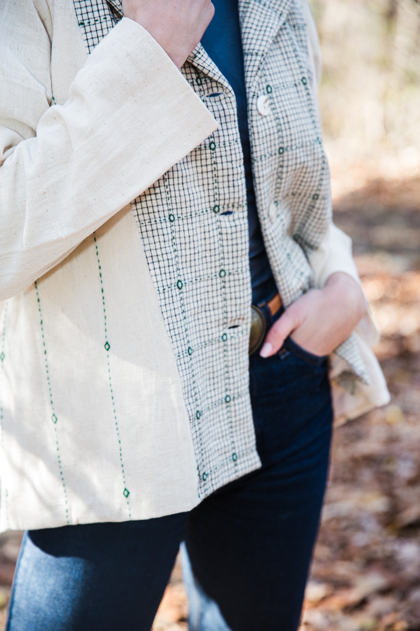 close up of handloom cotton and embroidered white jacket