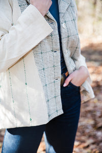 close up of handloom cotton and embroidered white jacket