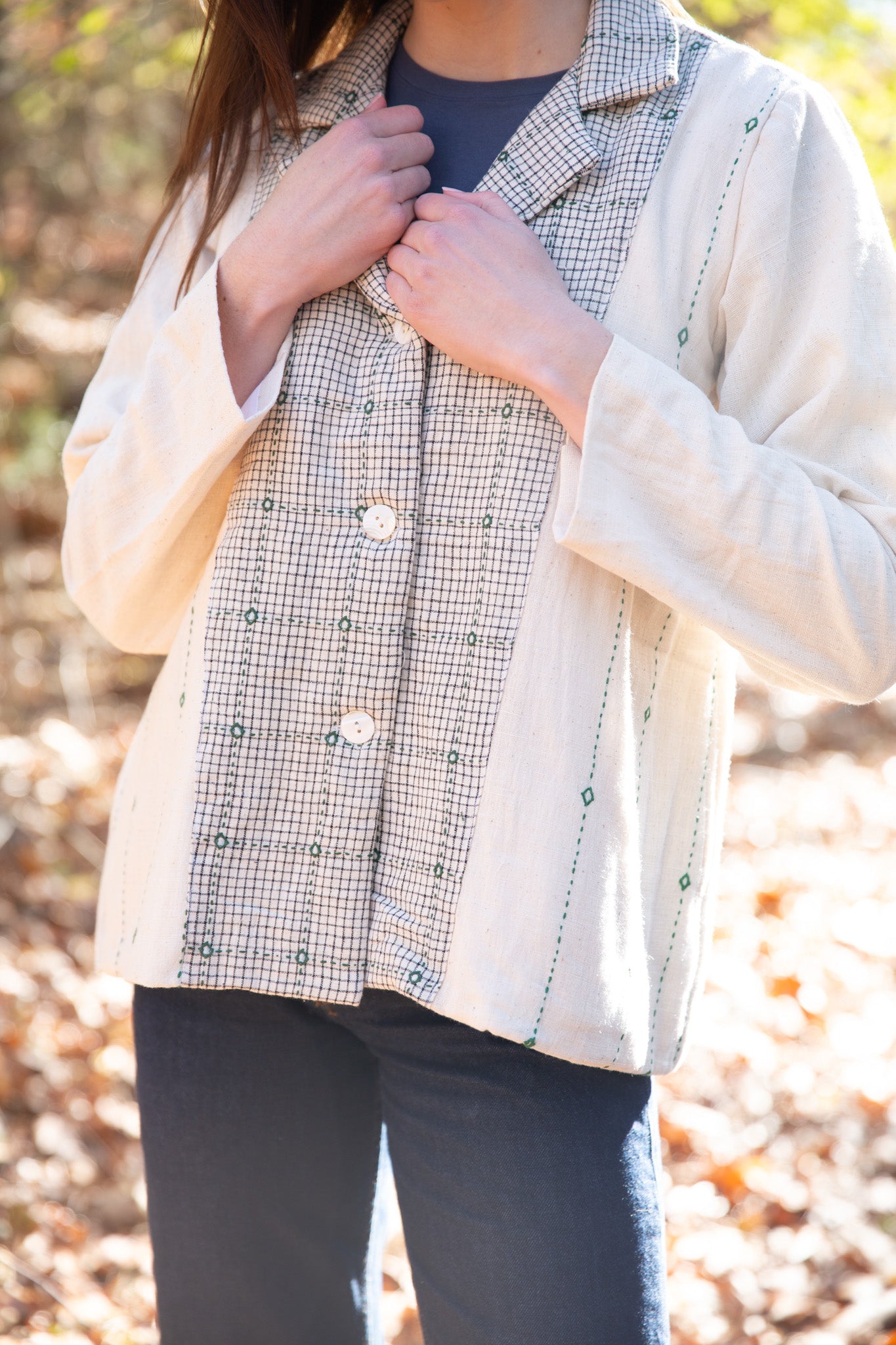 model wearing white artisanal embroidery jacket